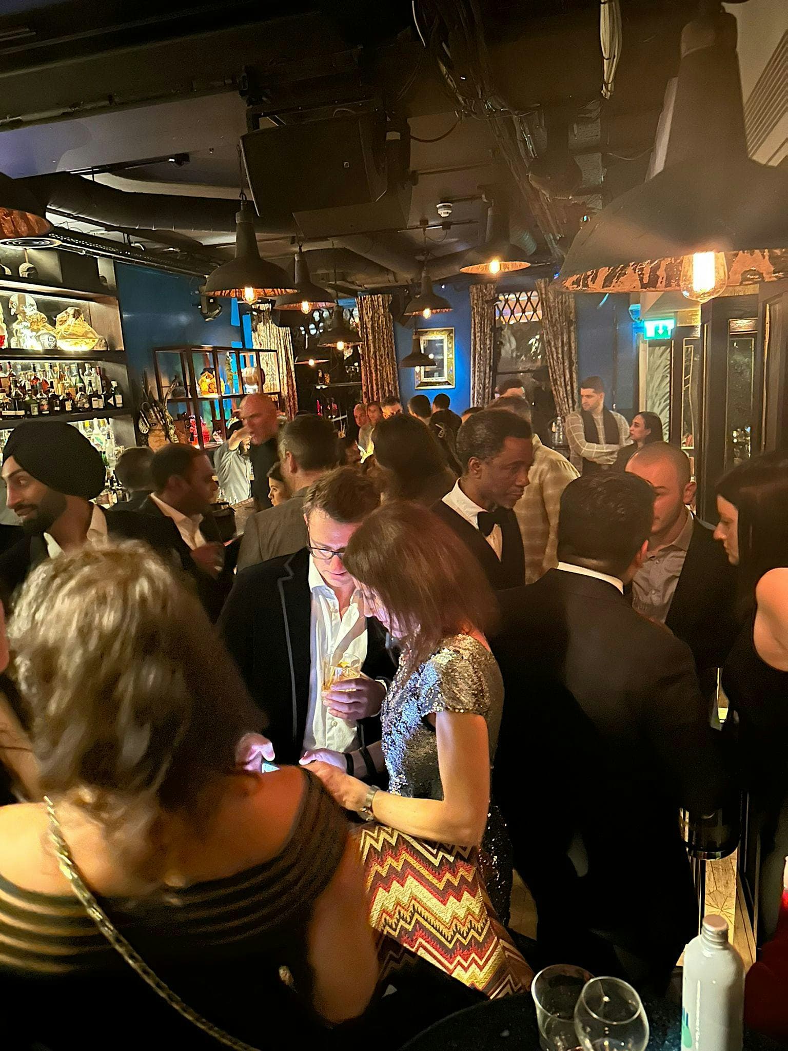 Guests in black tie at a PDN VIP networking reception